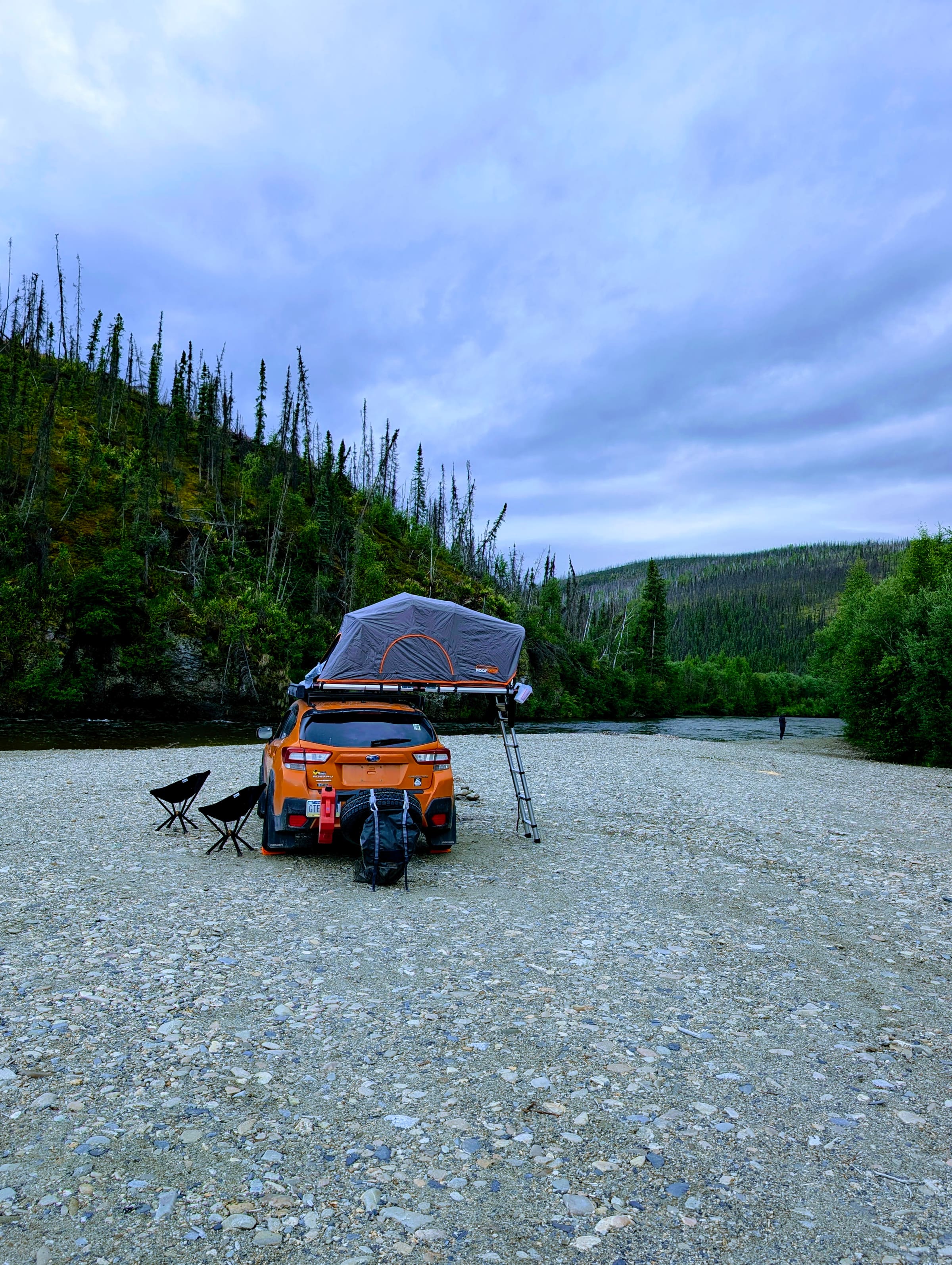 Camping by an Alaska river at dusk