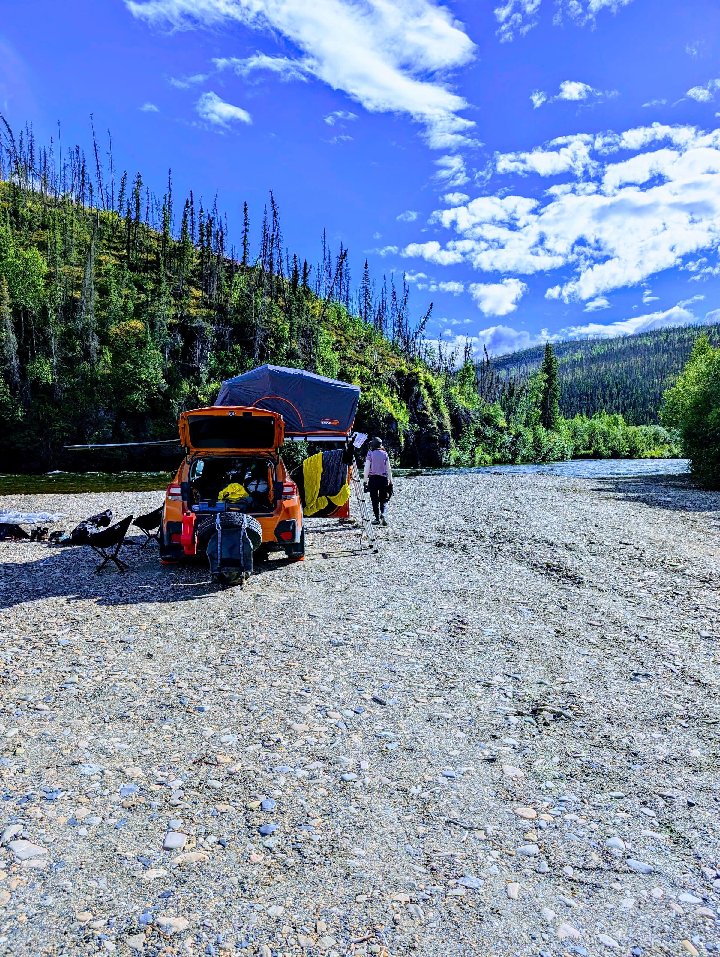 Rooftop tent camp on an Alaska river