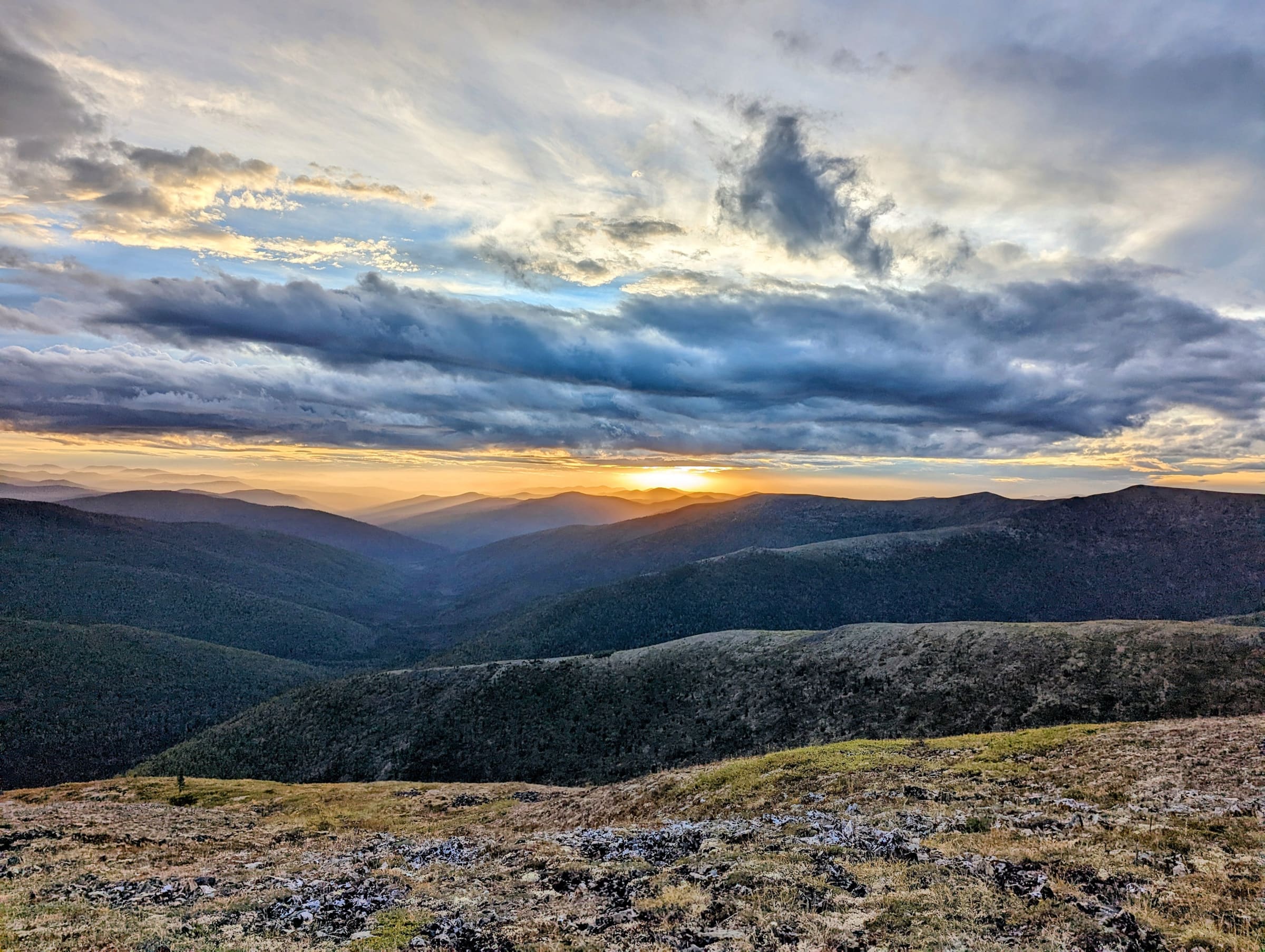 Low sun over the rolling tundra ridges of Interior Alaska