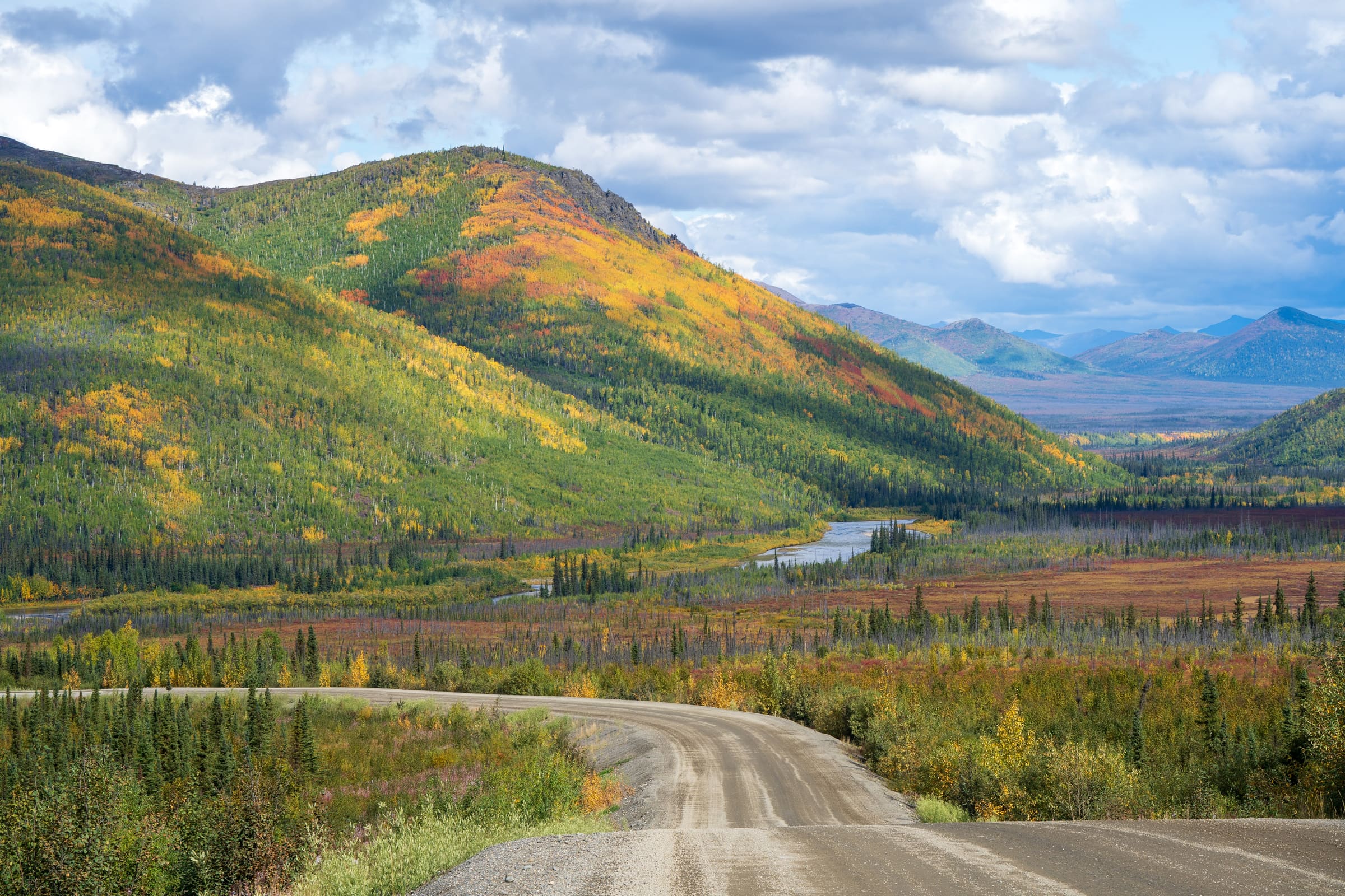 Winding Alaska road through autumn colors